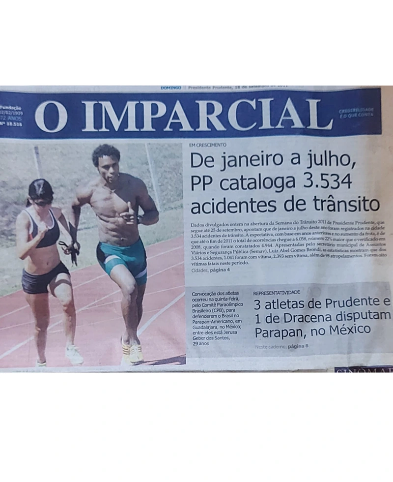 a newspaper with a man and woman running on a track